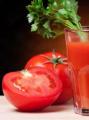 Tomato juice in a juicer for the winter